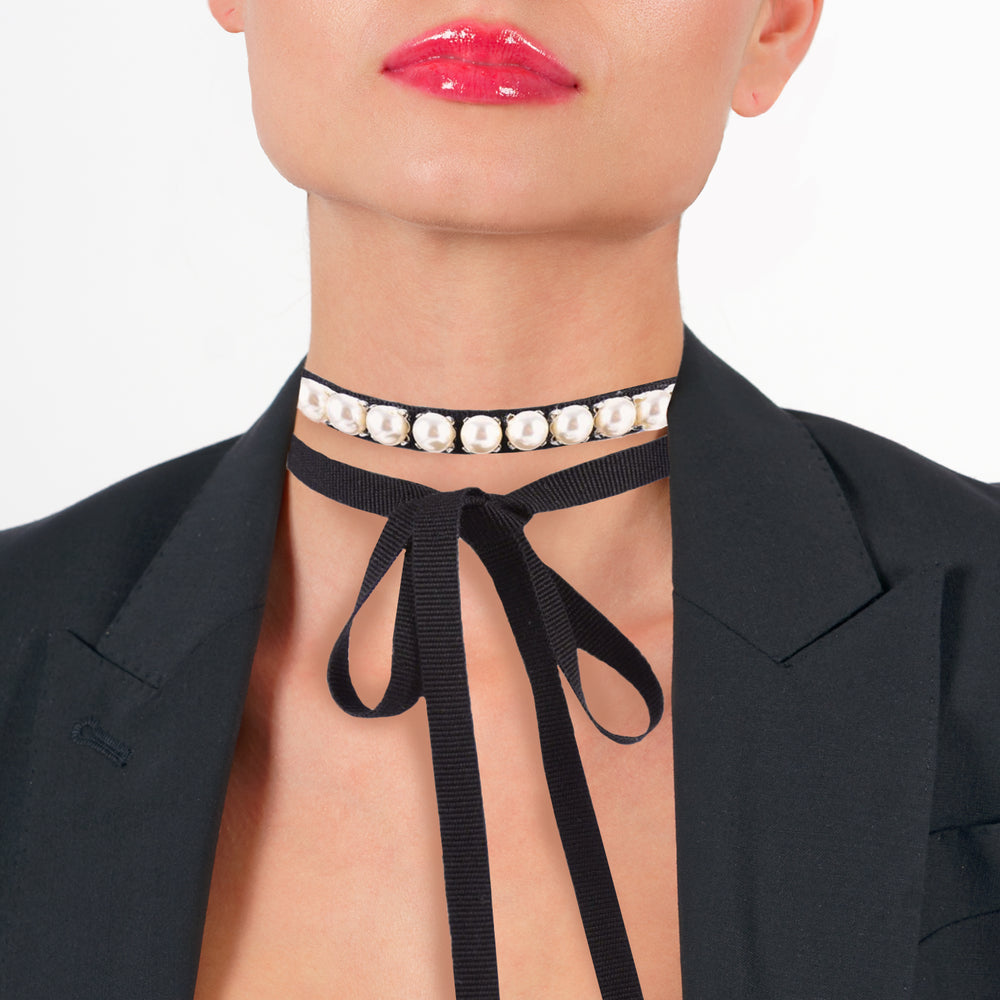 Pearls choker with black ribbon on model.