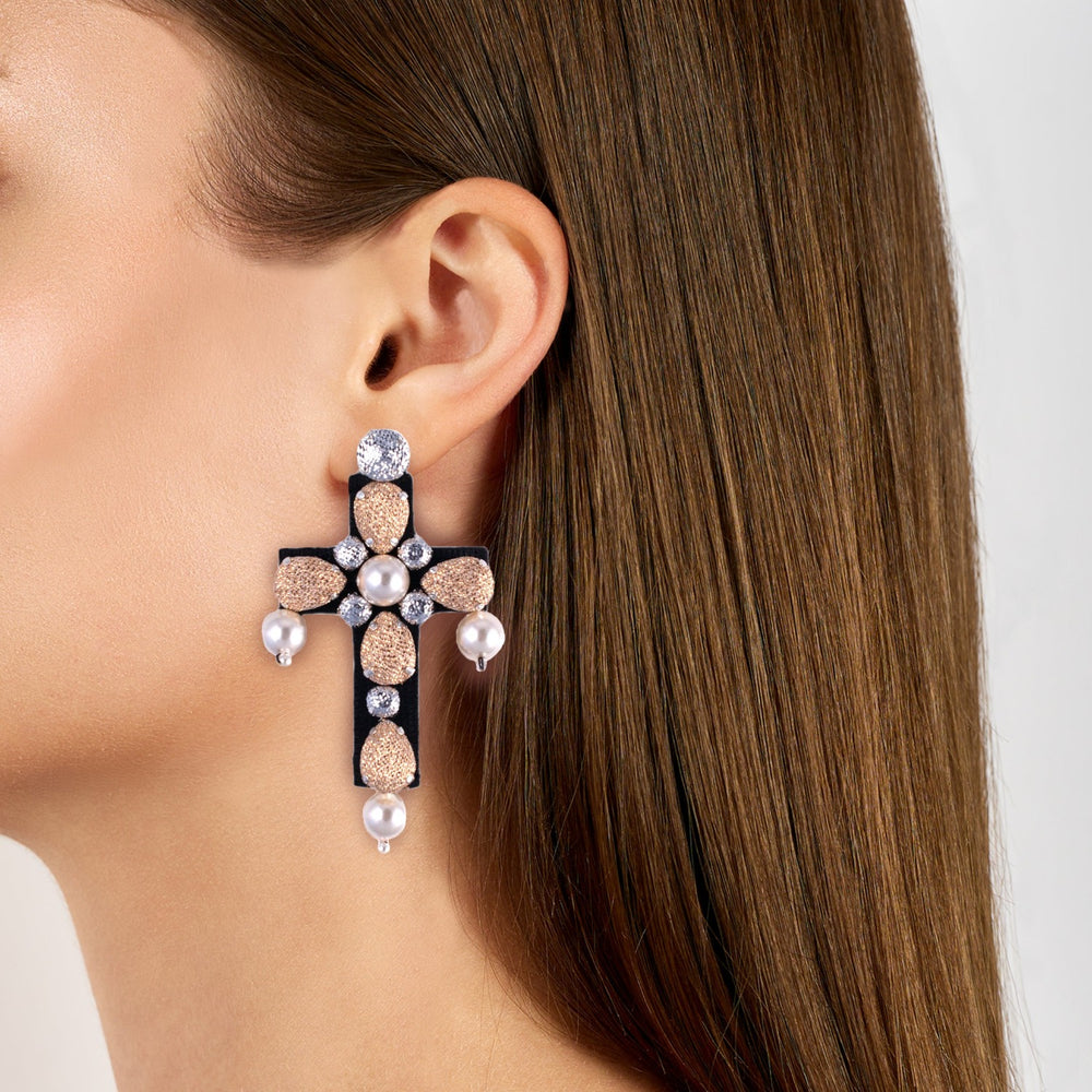 Cross lurex with pearls earrings on model.