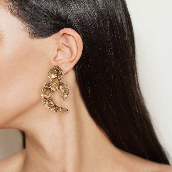 Arabesque lurex earrings on model.
