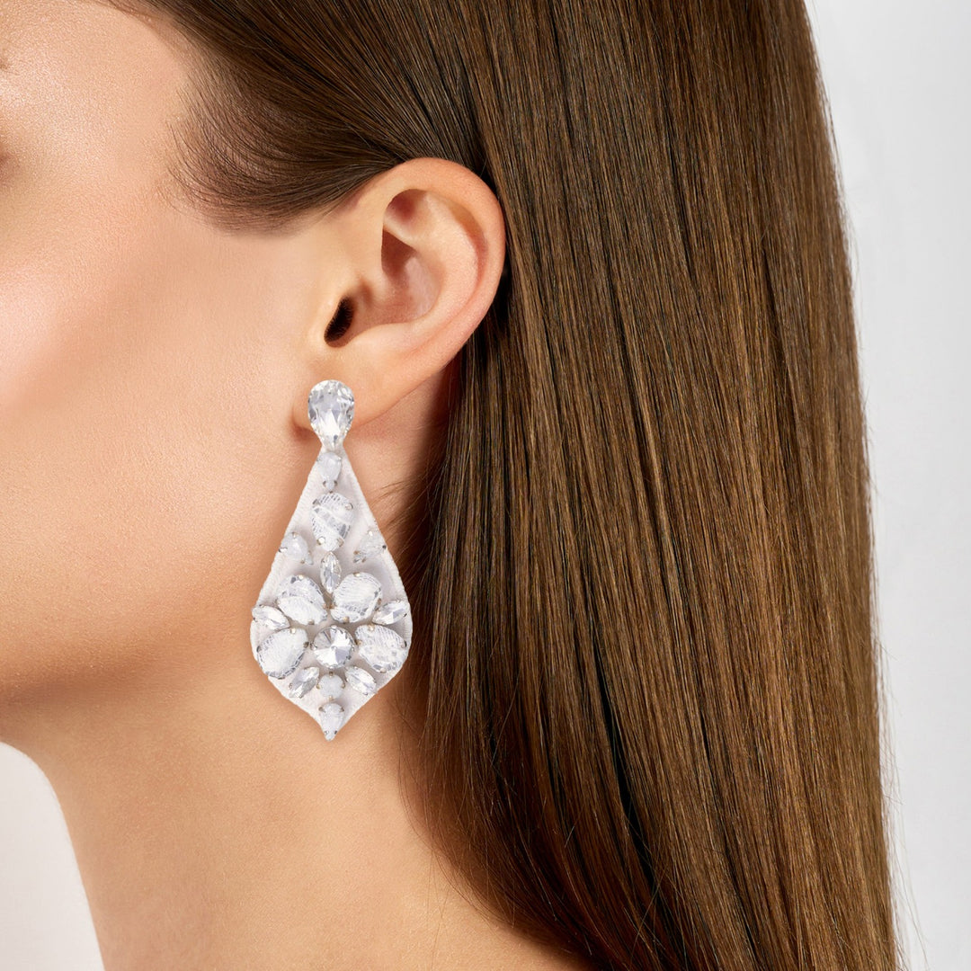Bell bridal white lace floral earrings on model.