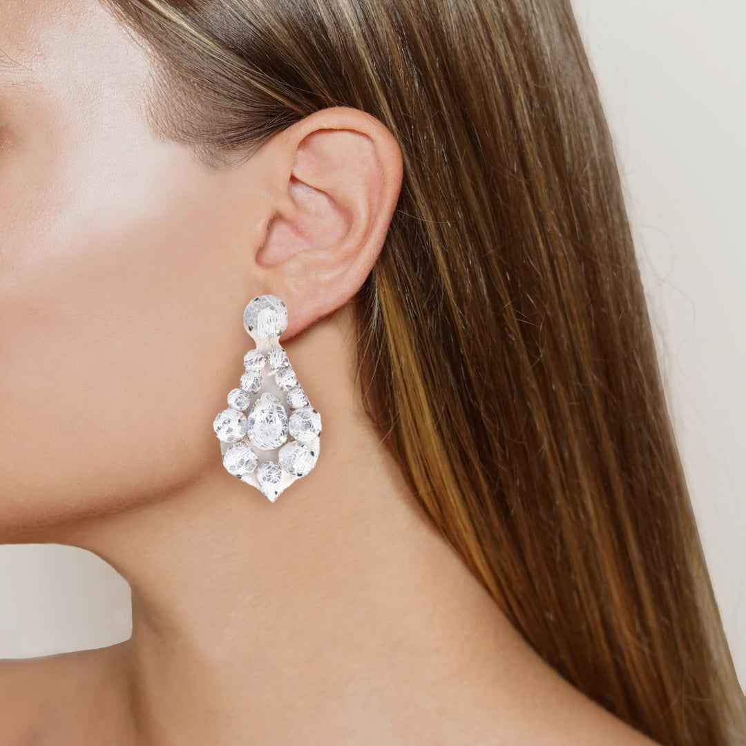Bell bridal lace earrings on model.