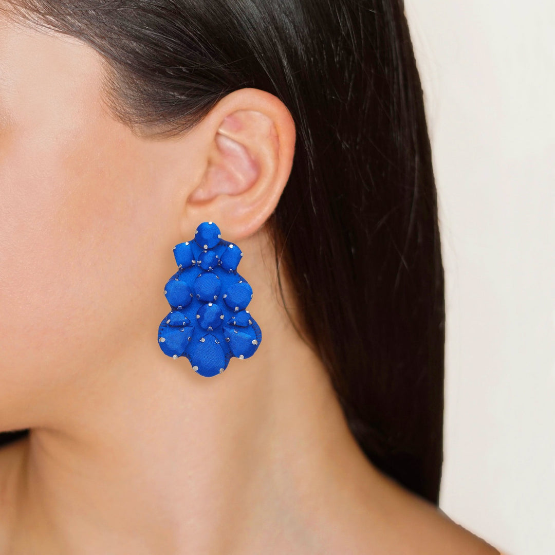 Chandelier silk earrings bright colours on model.