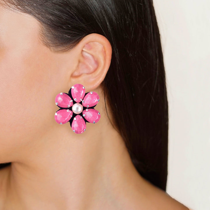 Flower earrings on model.
