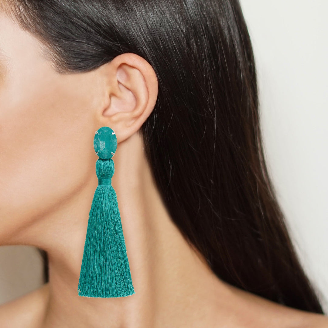 Fringe earrings on model.