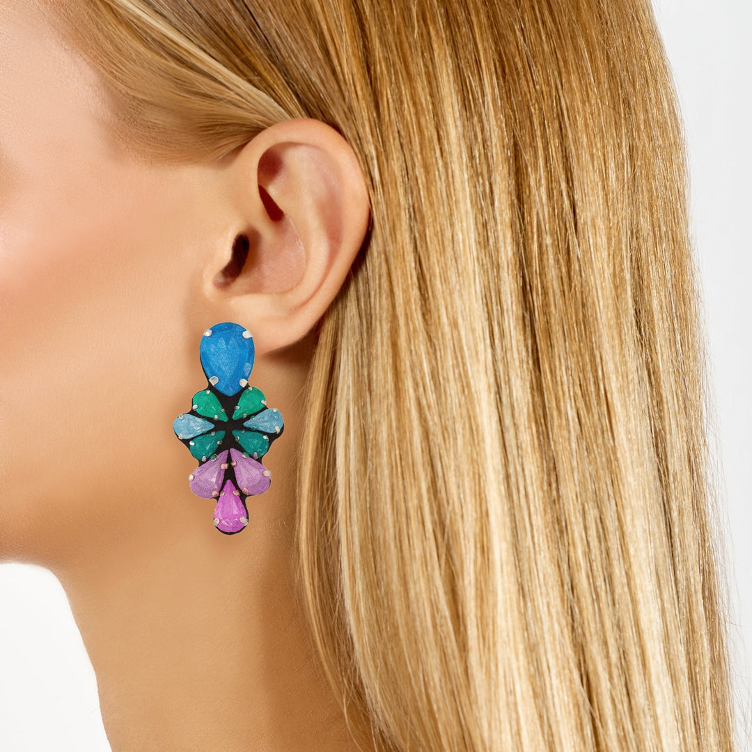 Glycine multicoloured earrings on model.