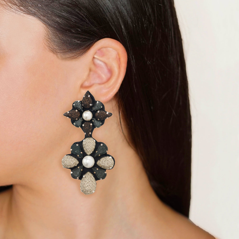 Mandala lurex earrings on model.