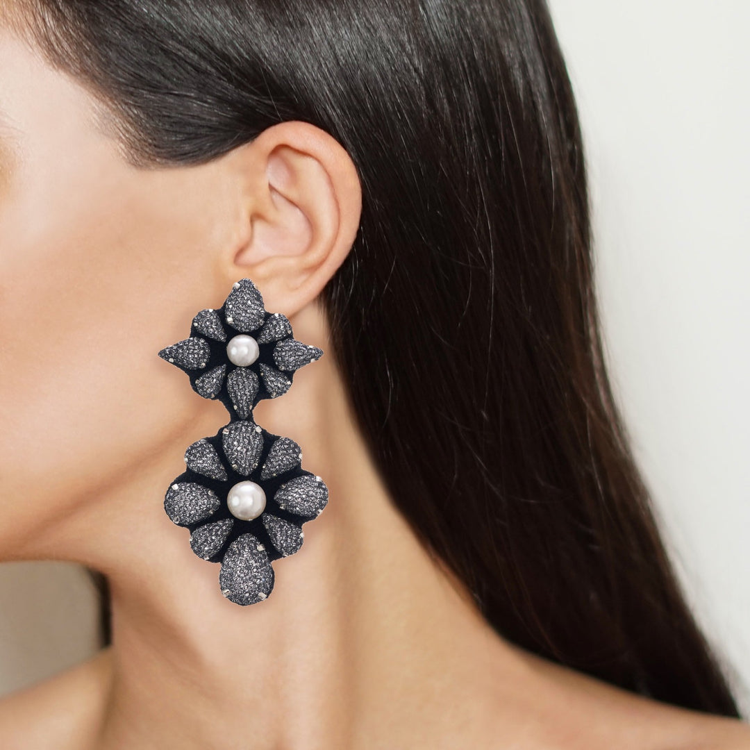 Mandala lace net earrings on model.