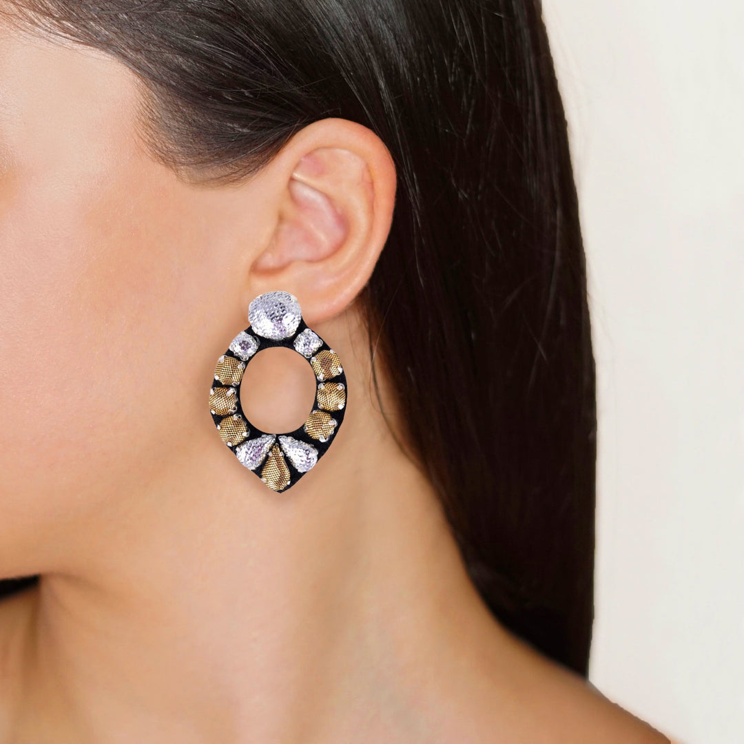 Mirror lurex earrings on model.