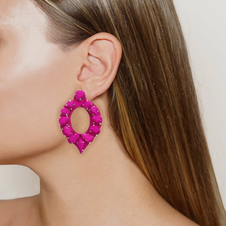 Mirror silk earrings on model.