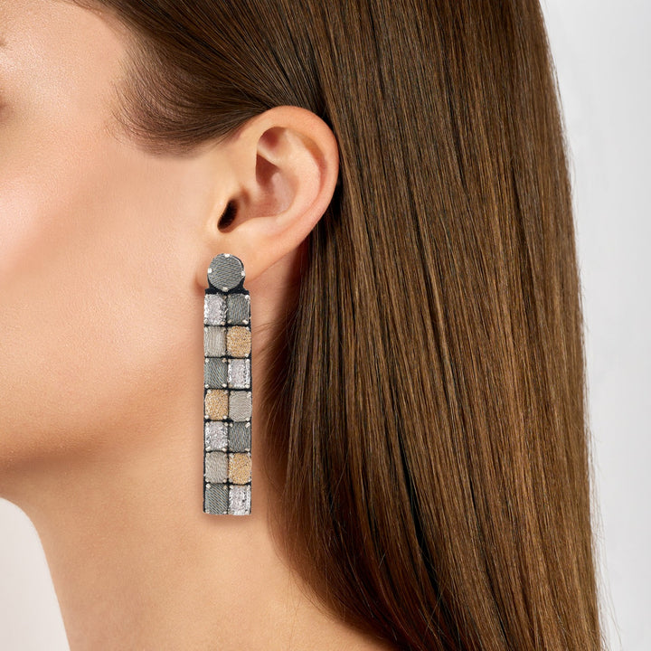 Mosaic lurex earrings on model.