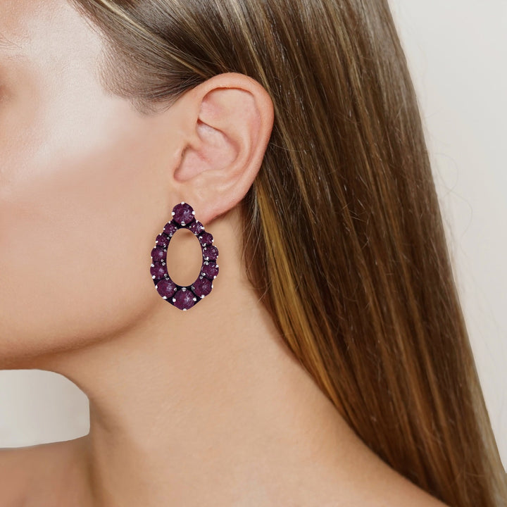 Oval silk veil earrings on model.