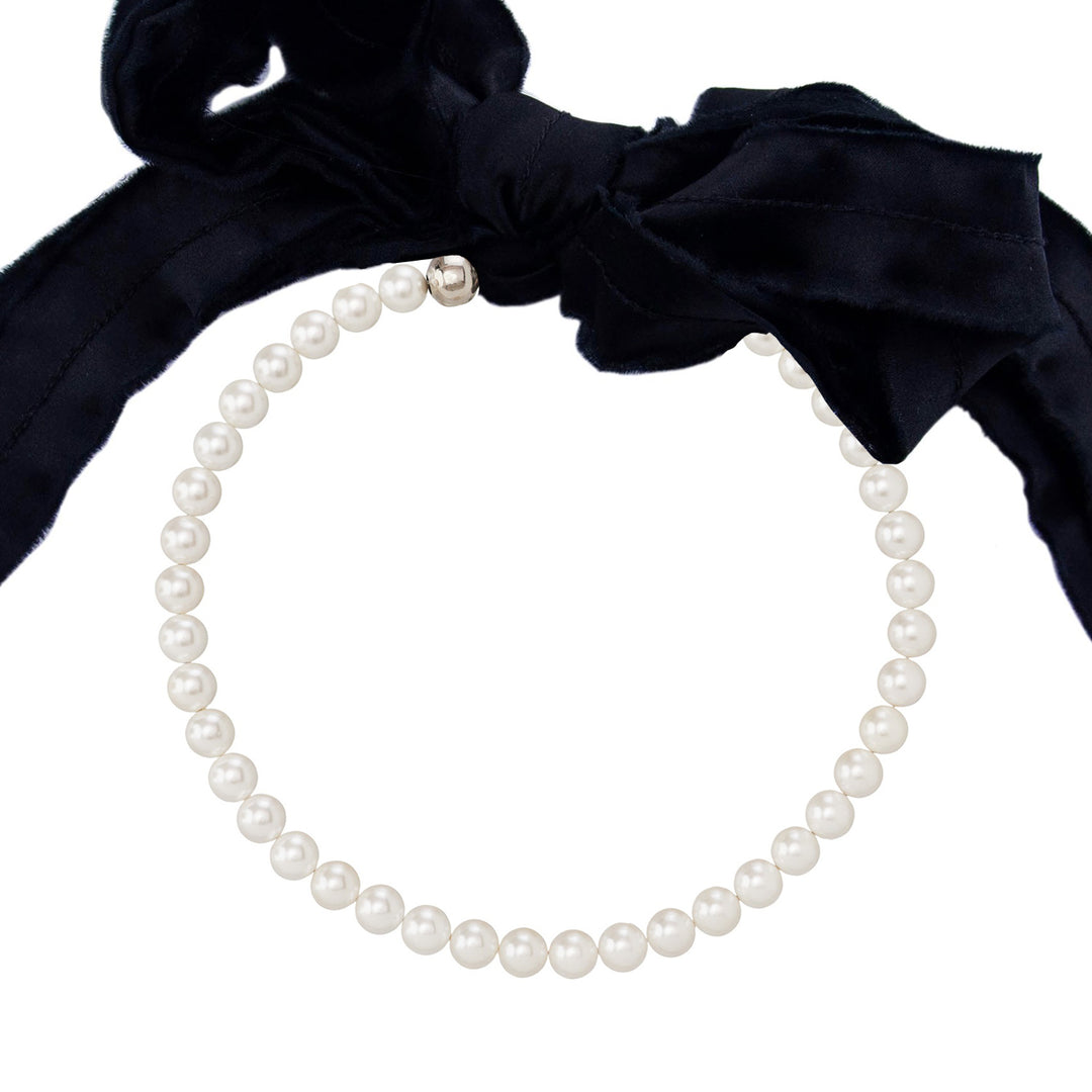Pearls necklace with black silk ribbon.