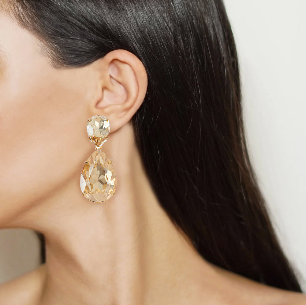 Puzzle earrings on model.