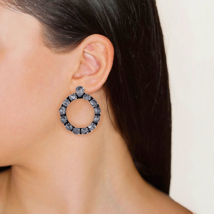 Ring lace earrings on model.