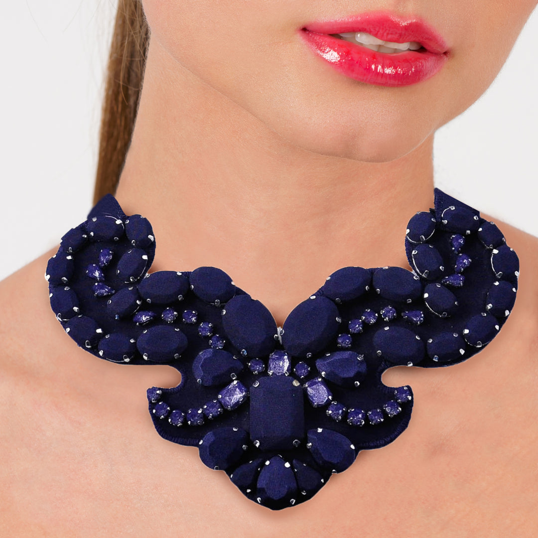 Statement dark purple silk necklace on model.