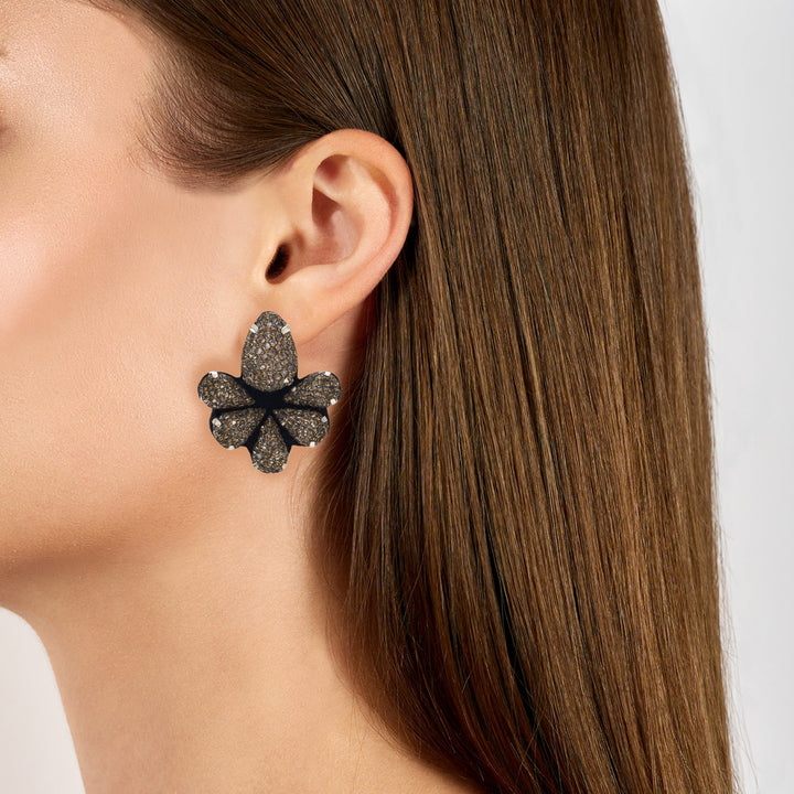 Water lily lace net earrings on model.